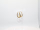 Gold hoop earrings on a white background